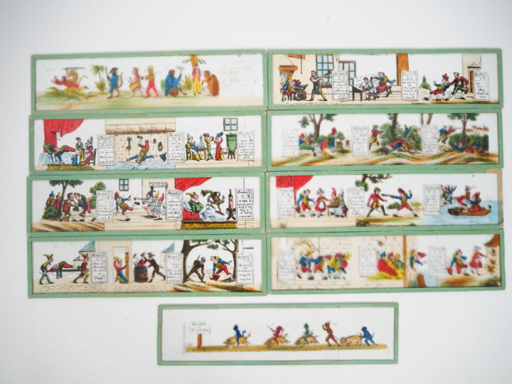 9 différentes plaques pour lanterne magique. Dim 7 x 27 cm.