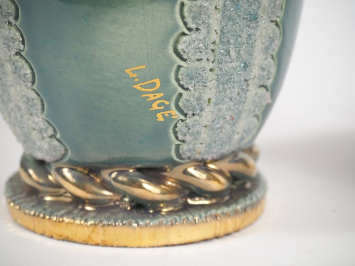 Louis DAGE. 3 différents vases en céramique. Signés. H. de 17 à 21 cm.