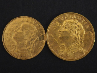 Vente aux enchères Ensemble comprenant :  - une pièce de 20 Francs or suisse, 1935. - une