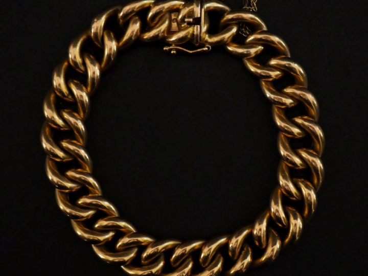 Bracelet souple en or jaune 750, maille gourmette.  Chainette de sécur