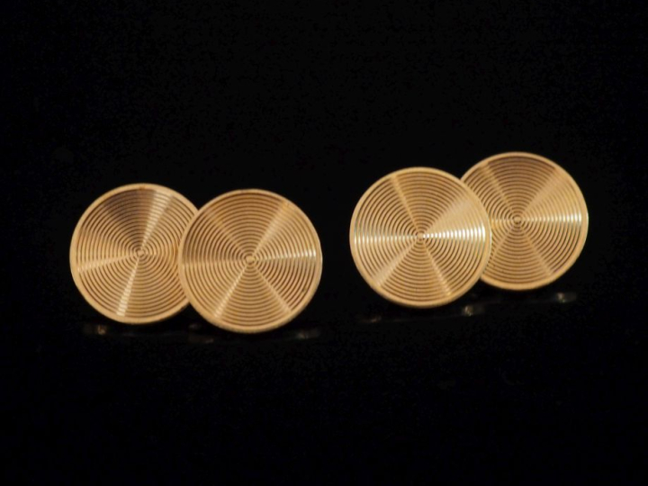 Paire de boutons de manchettes en or jaune 750, à décor de cercles con