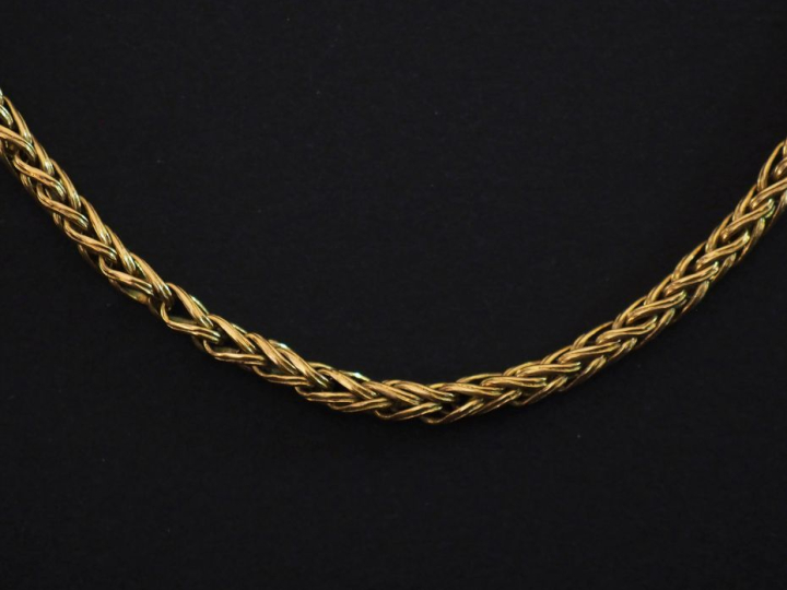 Collier souple en or jaune 750, maille ronde tressée.  Long. 51,5 cm P