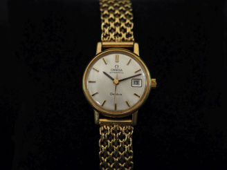 Vente aux enchères OMEGA Montre bracelet de dame, boitier et bracelet en or jaune 750.  C