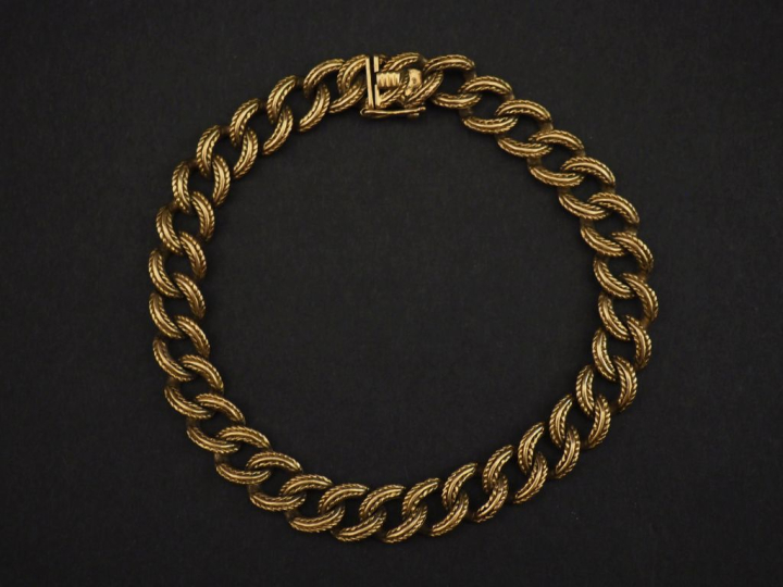 Bracelet souple en or jaune 750, maille gourmette stylisée. Long. 21,2