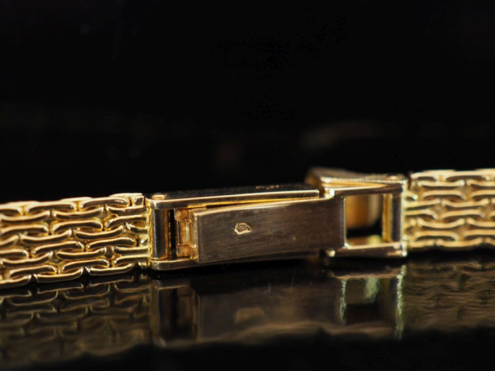 Bracelet de montre en or jaune 750, maille plate à décor de croisillon