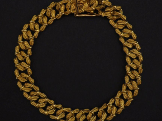 Vente aux enchères Bracelet souple en or jaune 750, maillons feuillagés.  Long. 17,5 cm P