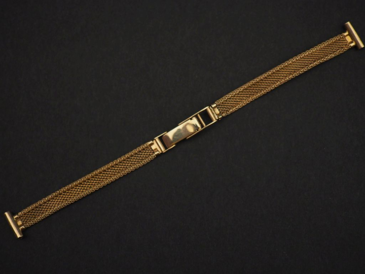 Bracelet de montre en or jaune 750, maille plate tressée.  Long. 13,5 