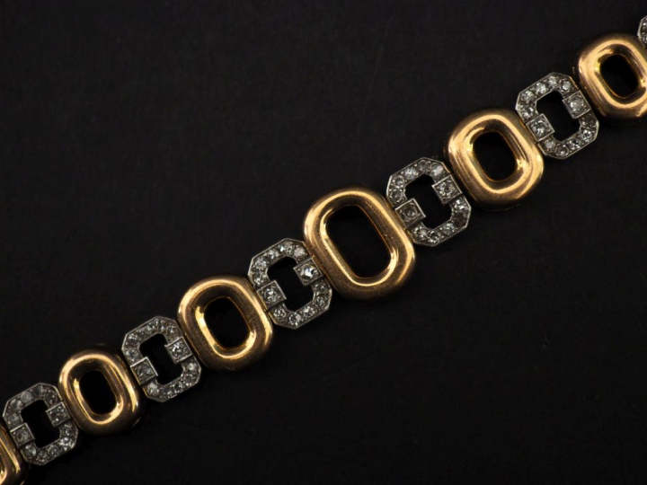 Bracelet articulé deux tons d'or 750, composé de maillons ovales en or