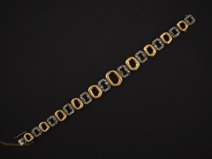 Bracelet articulé deux tons d'or 750, composé de maillons ovales en or