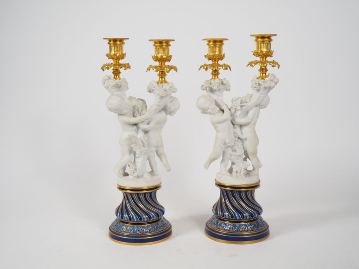 SEVRES.  Paire de bougeoirs doubles en porcelaine polychrome, bronze d