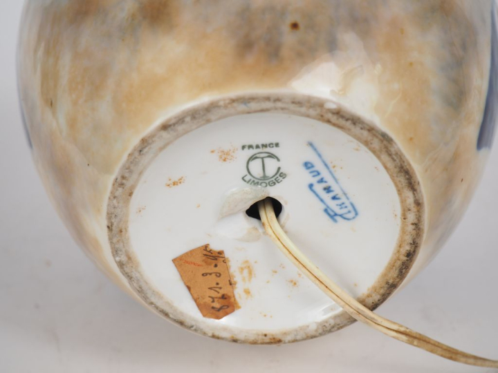 THARAUD.  Vase ovoide en porcelaine polychrome à décor de fleurs, (mon