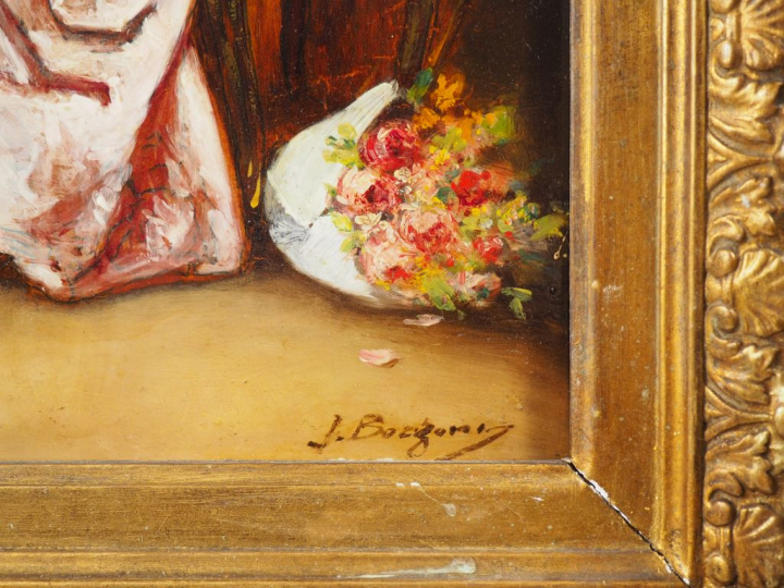 J. BOLZONI.  "Elégante se chaussant" Huile sur panneau, signée en bas 