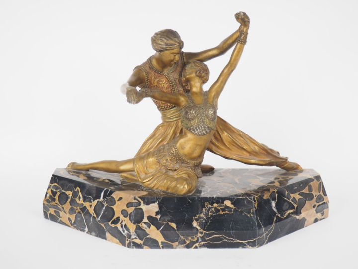 Claire COLINET.  "la danse"  Groupe en bronze patiné et doré sur un so