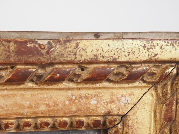 Miroir fin XIXème - début XXème de style Louis XVI en bois et stuc dor