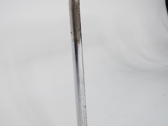 Table basse années 70 en métal chromé et tissu noir, plateau en verre.