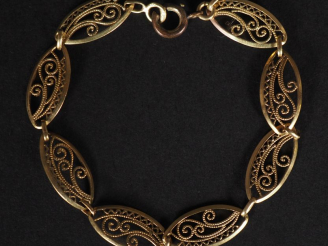 Vente aux enchères Bracelet articulé en or jaune 750, composé de maillons ovales ajourés 