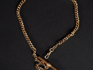 Vente aux enchères Giletière en or jaune 750, maille gourmette, agrémentée d'un fer à che