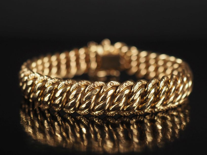 Bracelet souple en or jaune 750, maille américaine.  Chainette de sécu