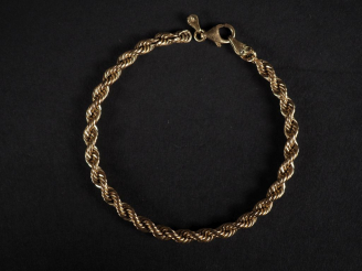 Vente aux enchères Bracelet souple en or jaune 750, maille torsadée.  Long. 19,5 cm Poids