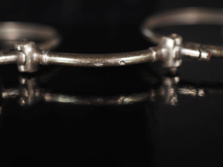 Binocles en argent.  H. 11 cm Poids. 13,27 g  (accidentées)