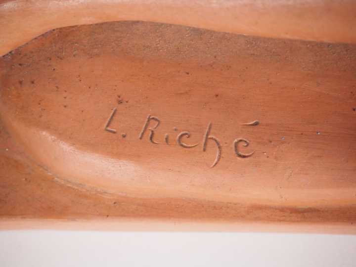 L. RICHE. "Jeune garçonne au chien loup." Groupe en terre cuite patiné