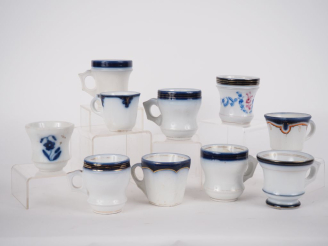 Vente aux enchères VALENTINE.  10 tasses "brulot" en porcelaine.