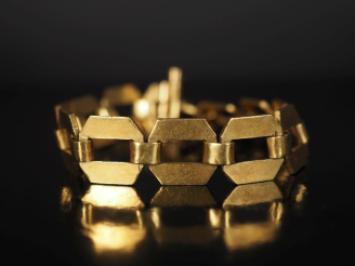 Vente aux enchères Bracelet articulé de style Art déco en or jaune 750, composé de maillo