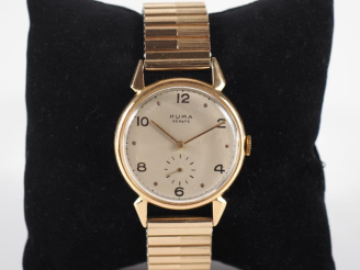 Vente aux enchères HUMA, Genève Montre bracelet, boitier en or jaune 750.  Cadran rond à 