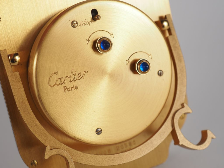 CARTIER, SANTOS Pendulette de table / réveil en acier et métal doré.  