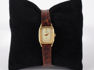Vente aux enchères CITIZEN Montre bracelet de dame.  Boitier en métal doré à pans coupés.