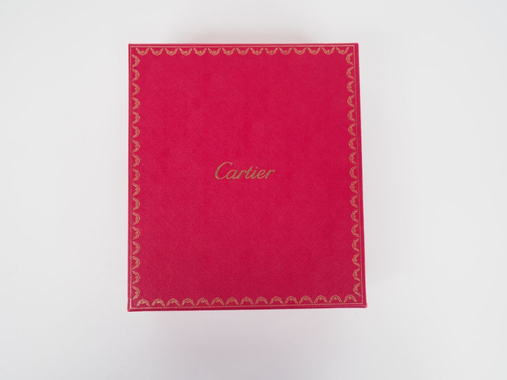 CARTIER, Paris Protège agenda et porte-cartes en cuir bordeaux.  Ferme