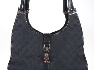 Vente aux enchères GUCCI Sac porté épaule, modèle "Jackie", en toile monogrammée noire.  