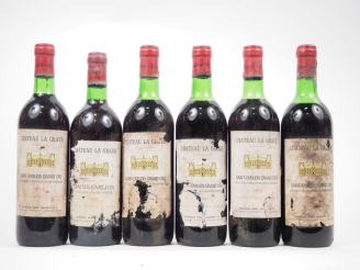 Vente aux enchères 6 BOUTEILLES CHÂTEAU LA GRAVE ST ÉMILION GC - 1970 - 1 BG/3 LB/1 HEP/E