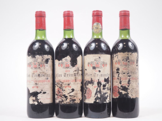 Vente aux enchères 4 BOUTEILLES CLOS TRIMOULET GC ST ÉMILION : 2 DE 1979 / 1 DE 1983 / 1 