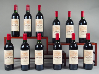 Vente aux enchères 12 BOUTEILLES CHÂTEAU BELAIR 1er GCC ST EMILION - 1997 - 2 BG/ 1 LB/1 