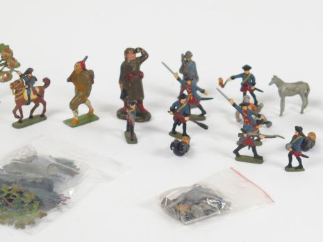 Lot de figurines comprenant : un lot de plats d'étain, arbres et végét