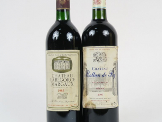 Vente aux enchères 2 BOUTEILLES : CHÂTEAU LABEGORCE MARGAUX 1985 BG - 1 CHÂTEAU ROLLAN DE