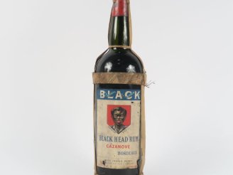 Vente aux enchères 1 VIEILLE BOUTEILLE (1 L) RHUM BLACK HEAD RUM CAZANOVE