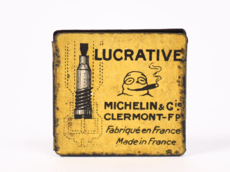Vente aux enchères MICHELIN. Petite boîte en tôle lithographiée jaune, valve lucrative ci