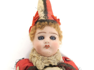 Vente aux enchères Jouet ancien marotte musical tête porcelaine de fabrication française 