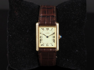 Vente aux enchères CARTIER, Must N° 108597 Montre bracelet, modèle Tank. Boitier en argen