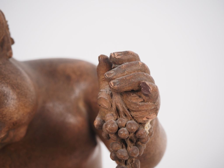 René ROD. "bacchus enfant" Sujet en terre cuite  Signé H. 33,5 cm (pet