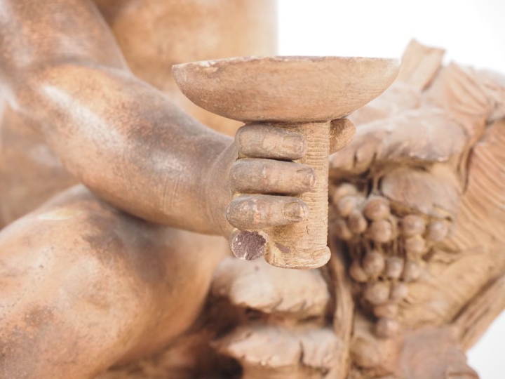 René ROD. "bacchus enfant" Sujet en terre cuite  Signé H. 33,5 cm (pet