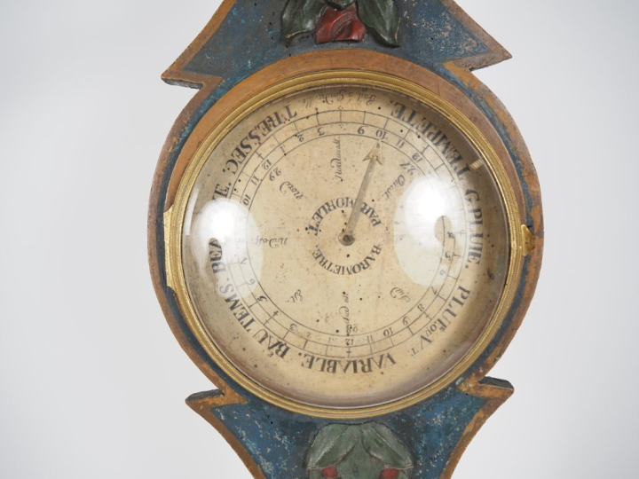 Baromètre début XIXème en bois peint, à décor en relief de fleurs poly