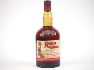 Vente aux enchères 1 VIEILLE BOUTEILLE RHUM CAÏMAN GRANDE MARQUE "ROI DES RHUMS" - CAPS A
