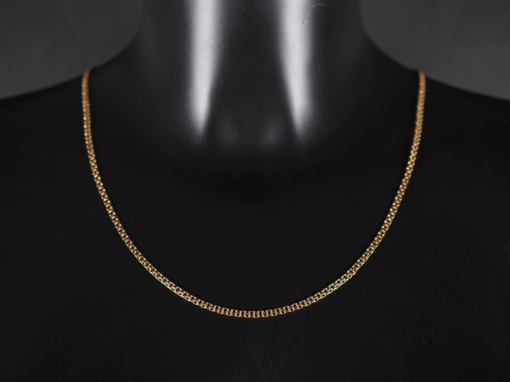 Collier souple en or jaune 750, maille ajourée fantaisie.  Long. 59,3 