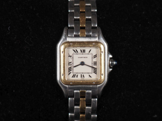 Vente aux enchères CARTIER Panthère Montre bracelet de dame en acier et or jaune 18k (750