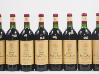Vente aux enchères 8 BOUTEILLES CHÂTEAU PHÉLAN SÉGUR ST ESTÈPHE - 1986