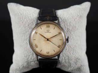 Vente aux enchères OMEGA Montre bracelet en métal.  Cadran rond à chiffres romains et ind