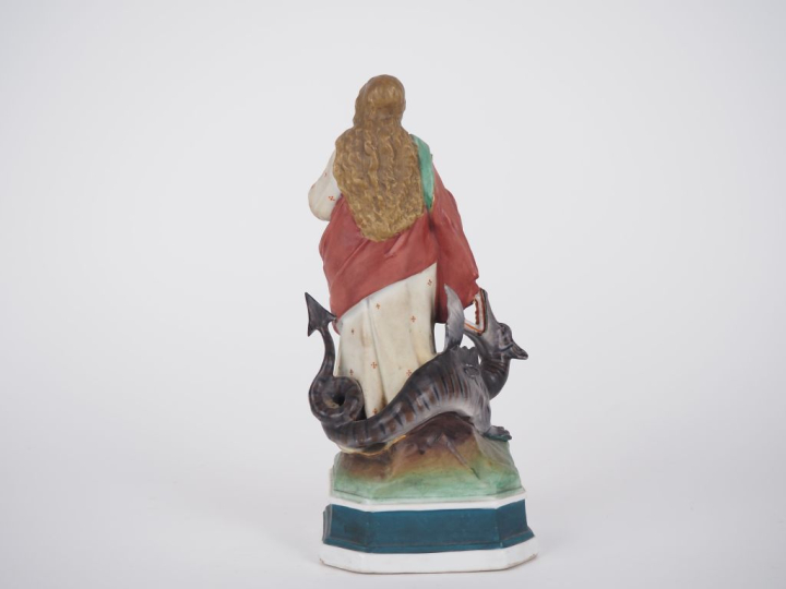 Sujet en biscuit polychrome "Sainte terrassant le dragon". (manques) H